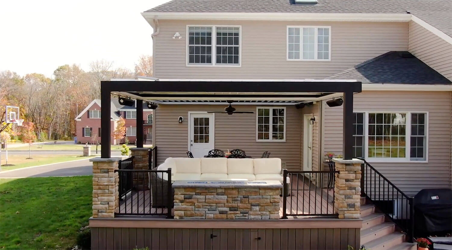 Deck builders constructing a custom backyard deck for a home.